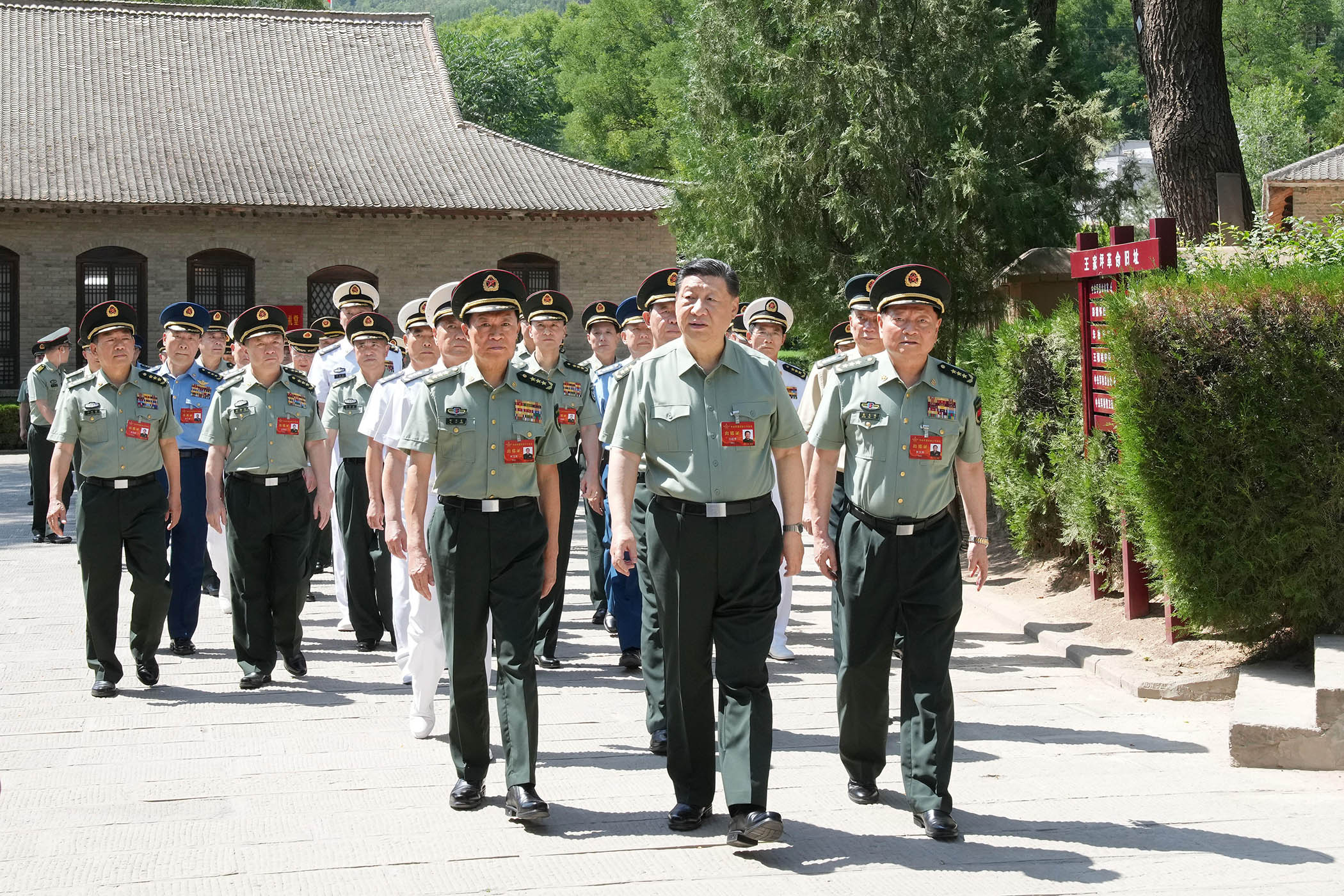 Chinese president Xi Jinping leads CMC members during a visit to the revolutionary relics at Wangjiaping in Yan'an, northwest China's Shaanxi province, in 2024