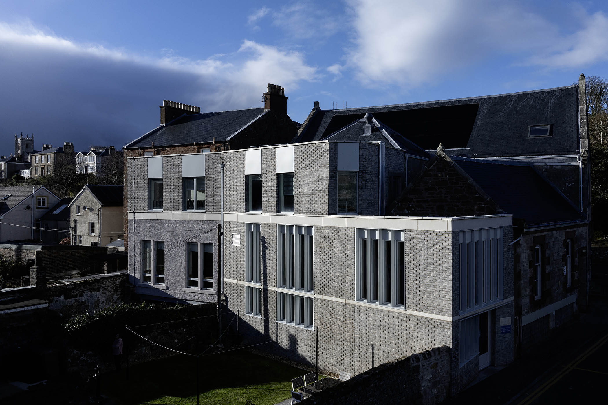 O’Donnell Brown’s designs are ‘complementary rather than imitative’, with an extension sliding down the side of the old building and, below, a ‘vertical rhythm of windows’