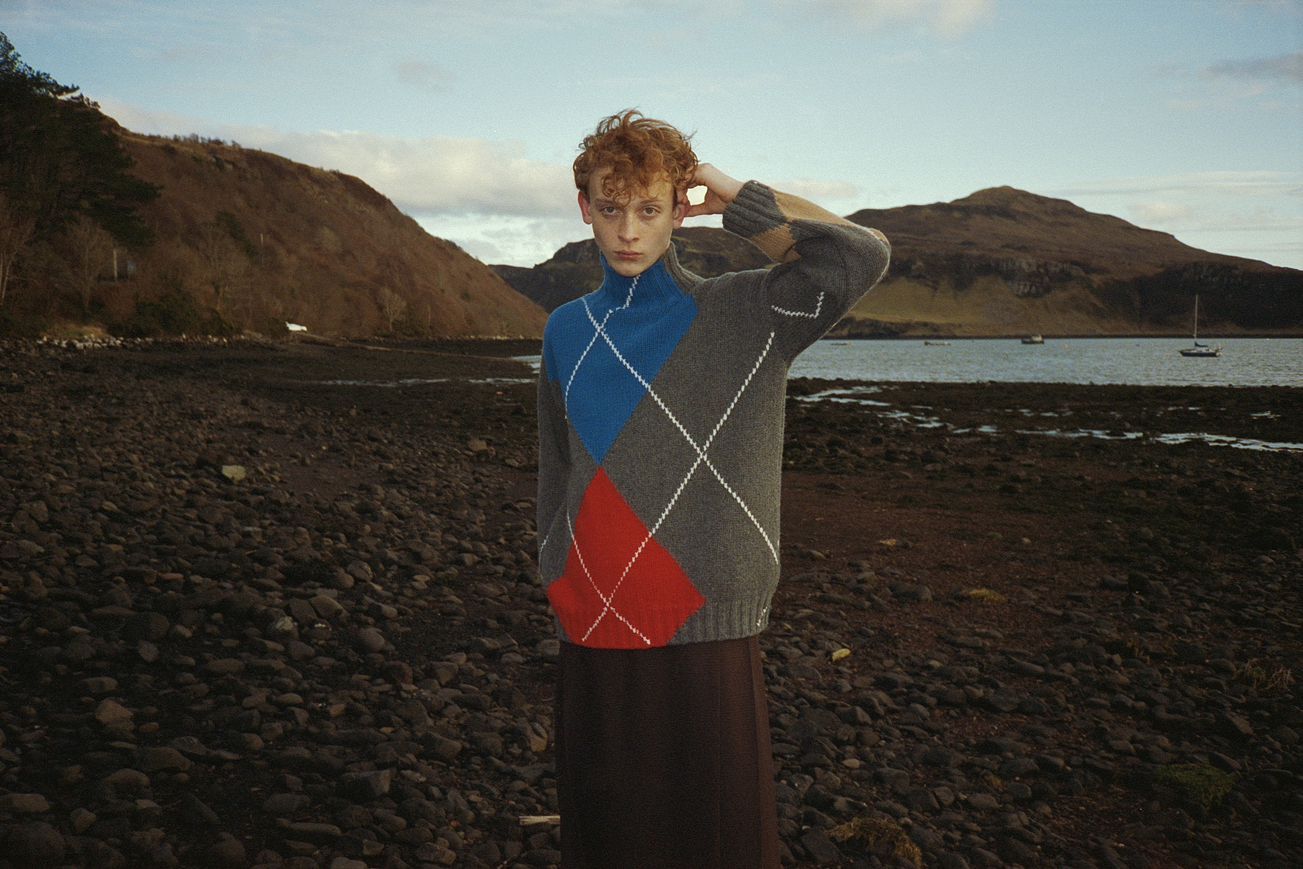 Ayrton Maberley, 18, kitchen porter: Ayrton has lived on Skye all his life. He currently works in the kitchens at the Cuillin Hills Hotel. He wears JW Anderson x Pringle knitted Argyle turtleneck, and kilt by Johnstons of Elgin x Le Kilt