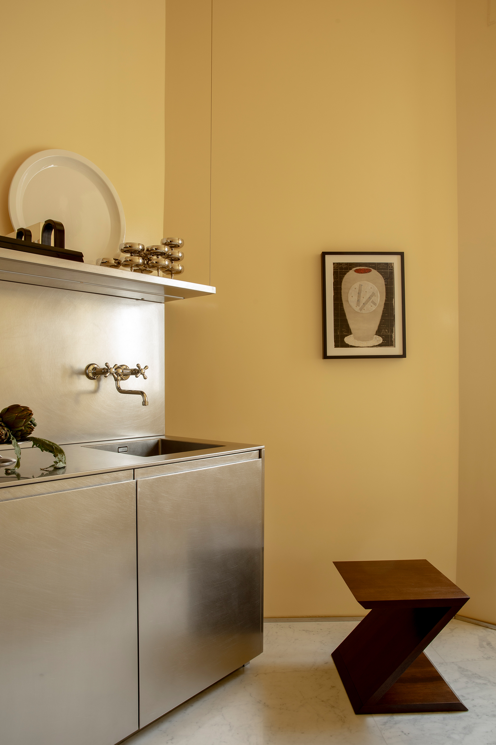 Armani Casa’s walnut Remy stool in the kitchen