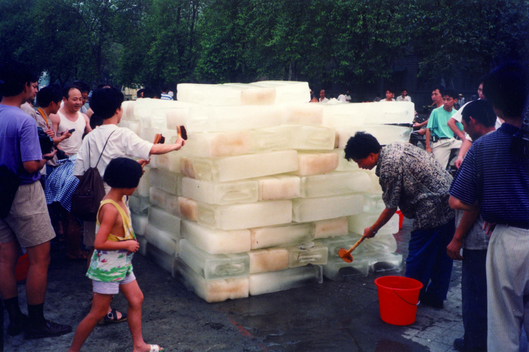 A still from Xiuzhen’s ‘moving video’ Washing River, 1995. Main image: visitors can enter her structure clothed with pink garments