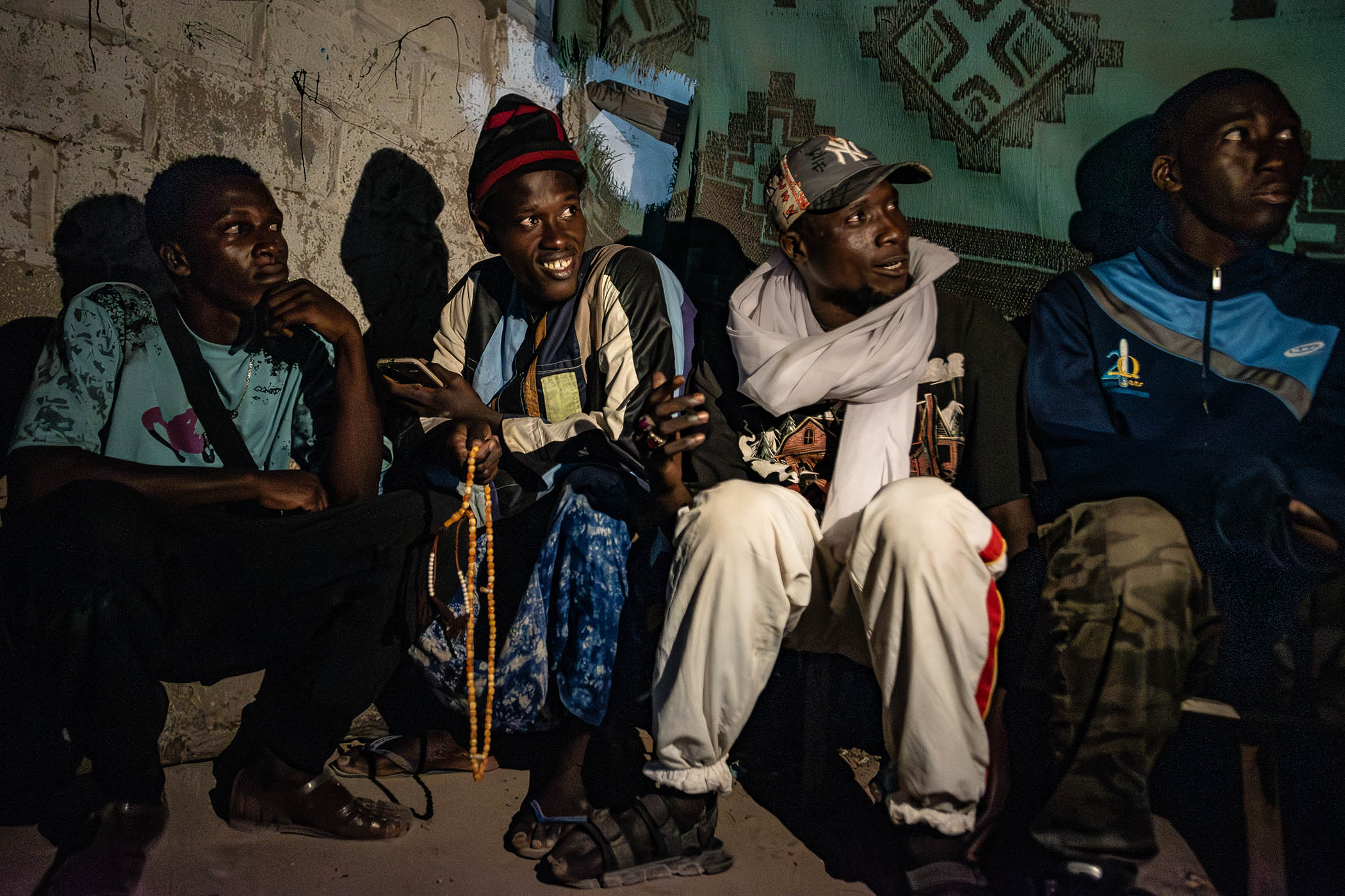 Senegalese migrants hoping to making the crossing pictured in a shelter in Nouadhibou