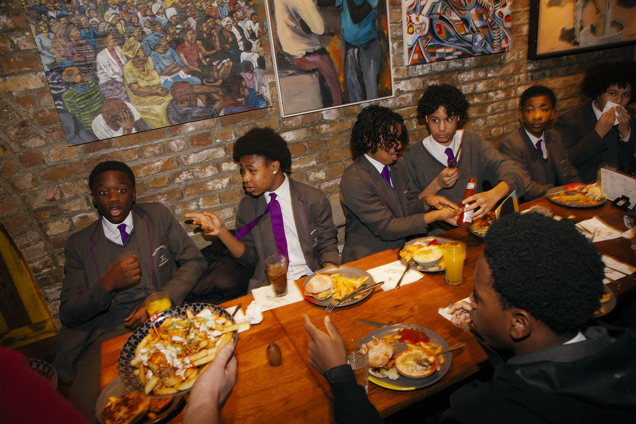 Pupils from Elms Academy in south London tuck into a Nando’s after their trip to the theatre