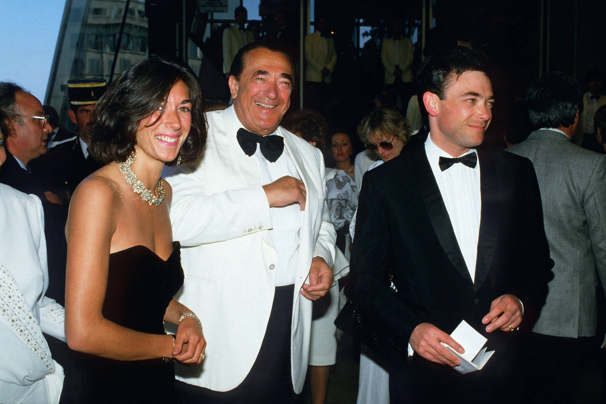 Ghislaine at the Cannes Film Festival in 1987 with her father, Robert, and brother Ian