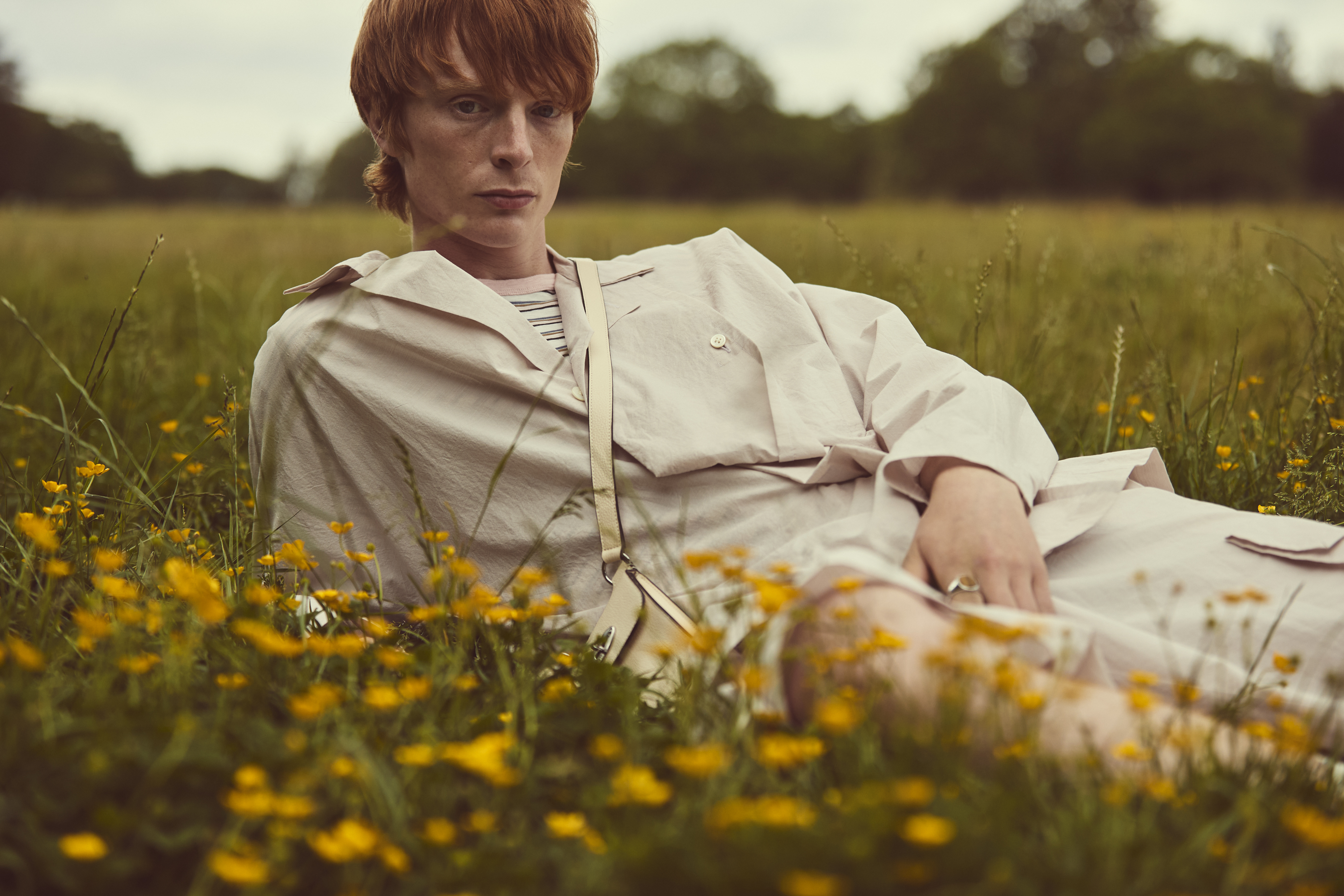 Long-sleeved shirt and shorts, both Homme Plissé Issey Miyake. Striped T-shirt by Folk; mini shoulder bag by Mulberry and Tiger eye ring by Tom Wood