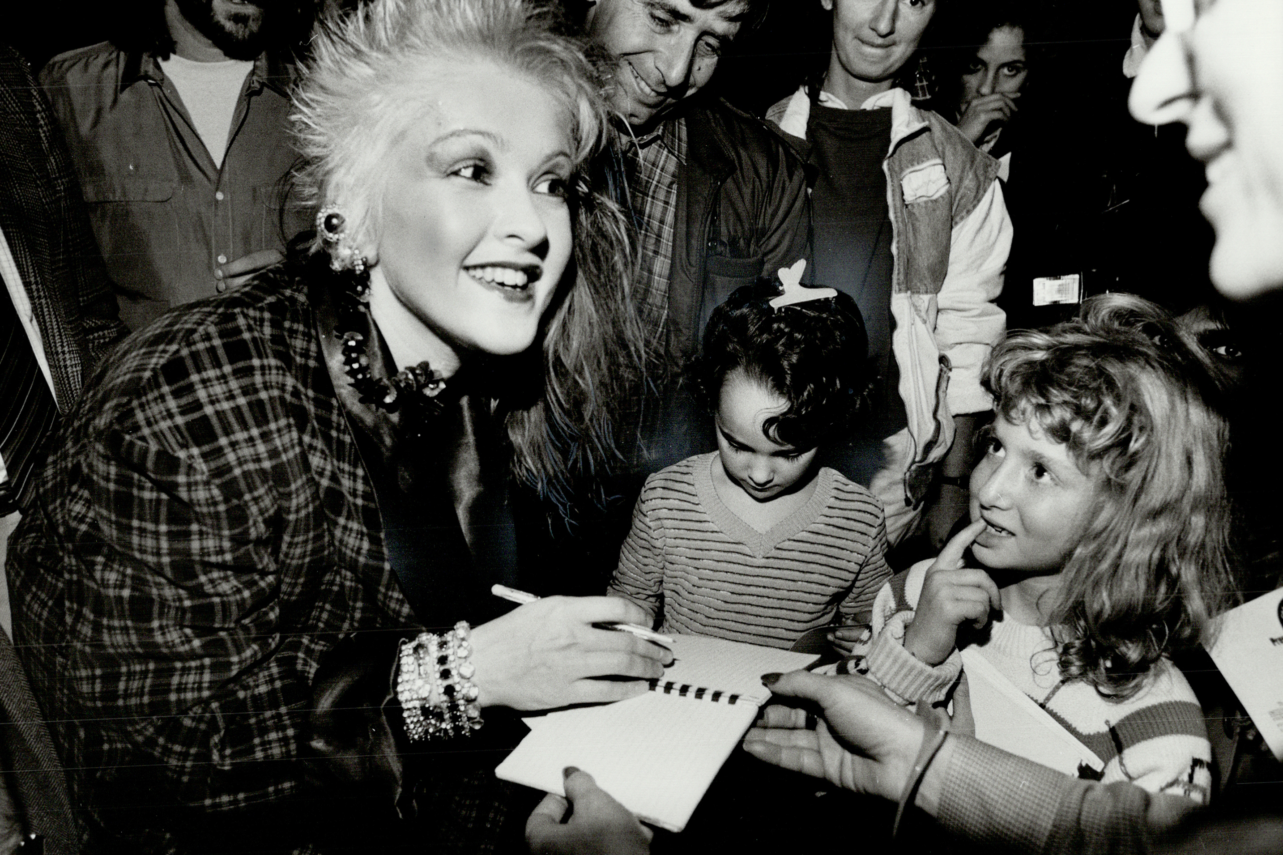 Lauper signing autographs in Toronto during her 1984 Fun Tour