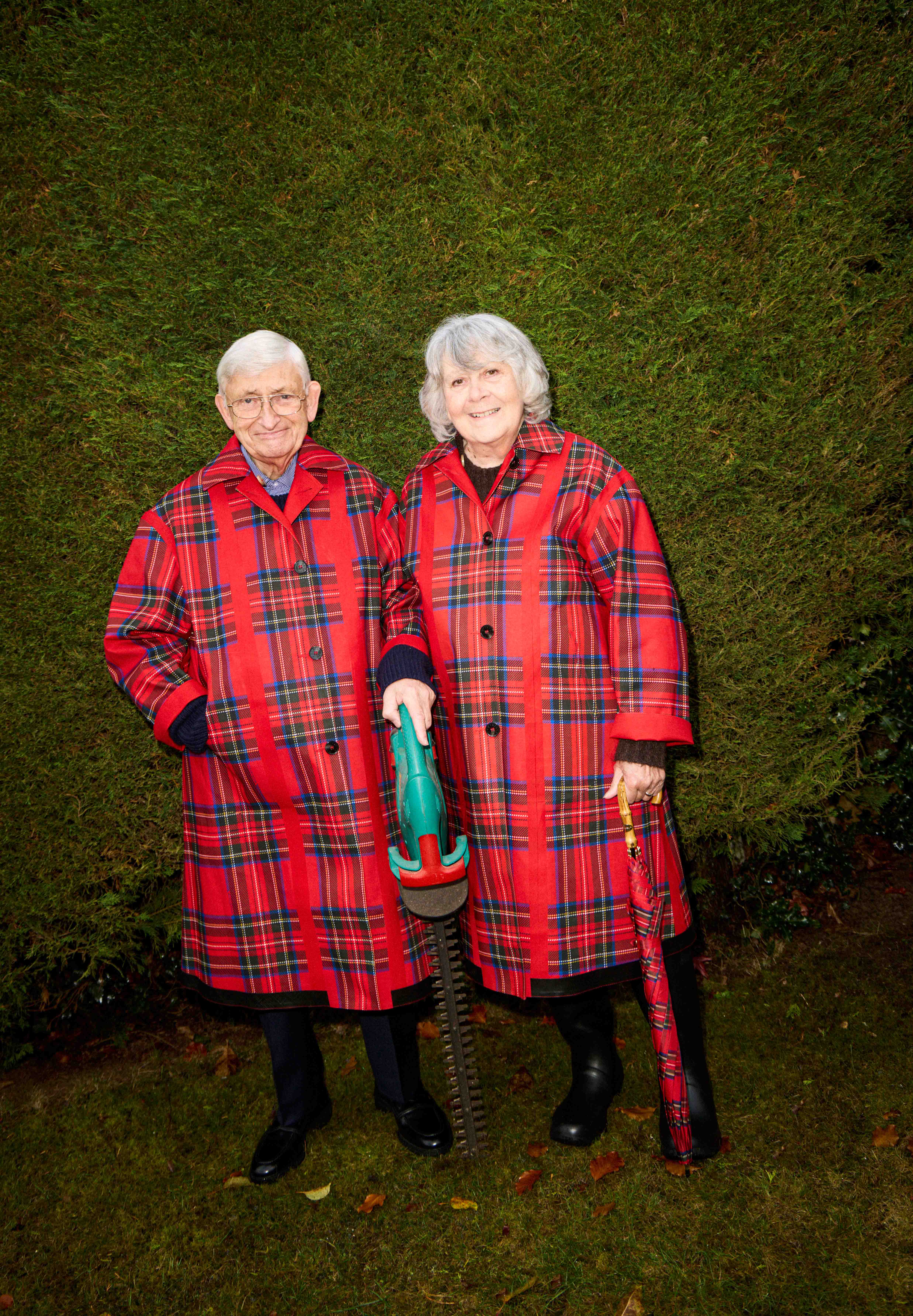 Michael and Teresa wear reversible rubberised coats, £1,595, by Mackintosh. Michael wears navy trousers, £99, by John Lewis; and penny loafers, £705, Santoni. Teresa wears wellingtons, £109, by Barbour; and umbrella £145, Mackintosh