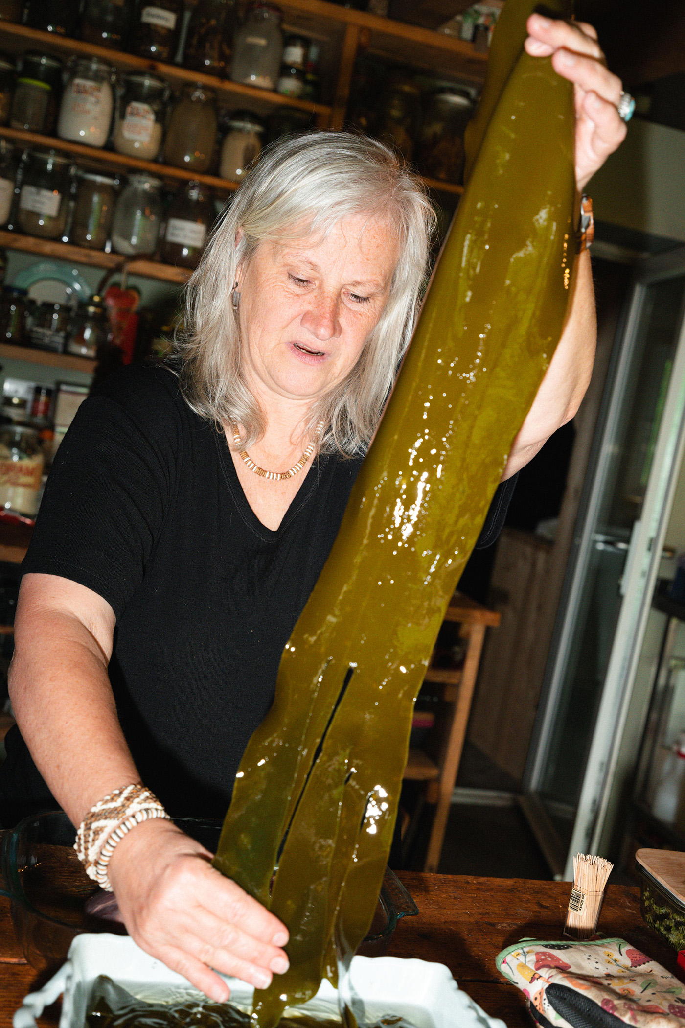 Mo soaks oarweed seaweed in water to wrap a haunch of venison in
