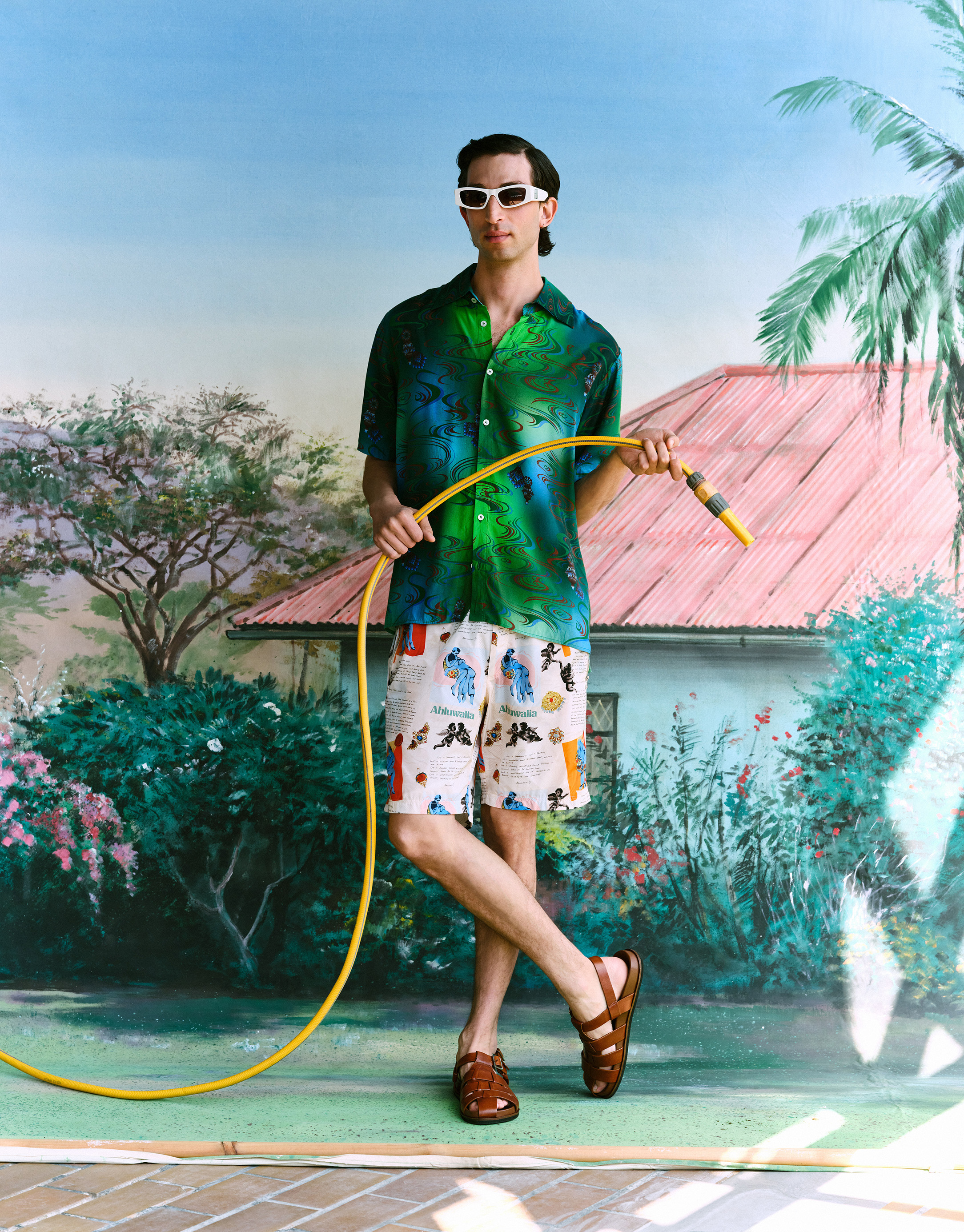 Shirt and shorts both by Ahluwalia; sunglasses by Balenciaga; sandals by Grenson