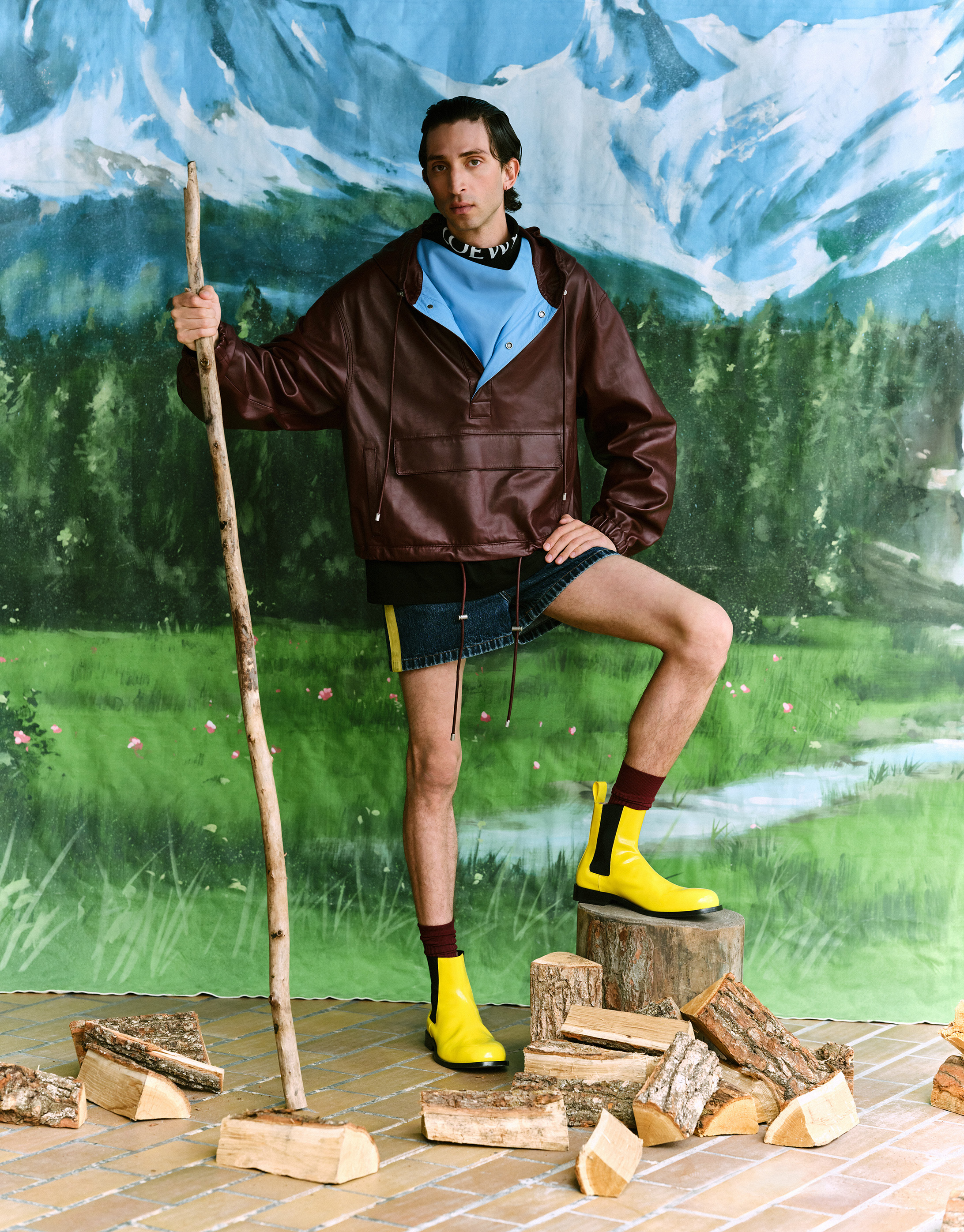 Leather cagoule, roll neck, denim shorts and yellow boots, all by Loewe