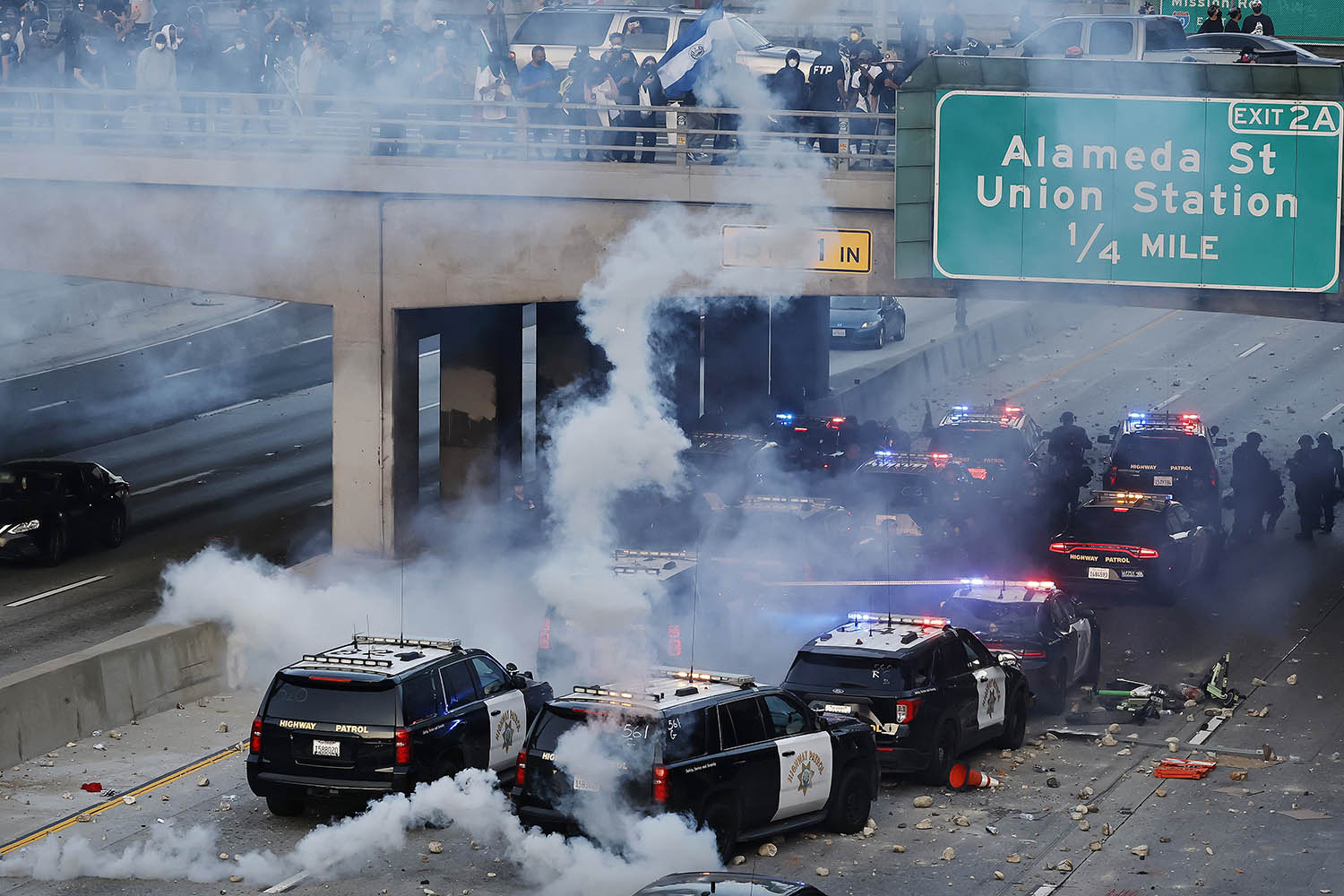 A flash bomb explodes on the motorway near the detention centre
