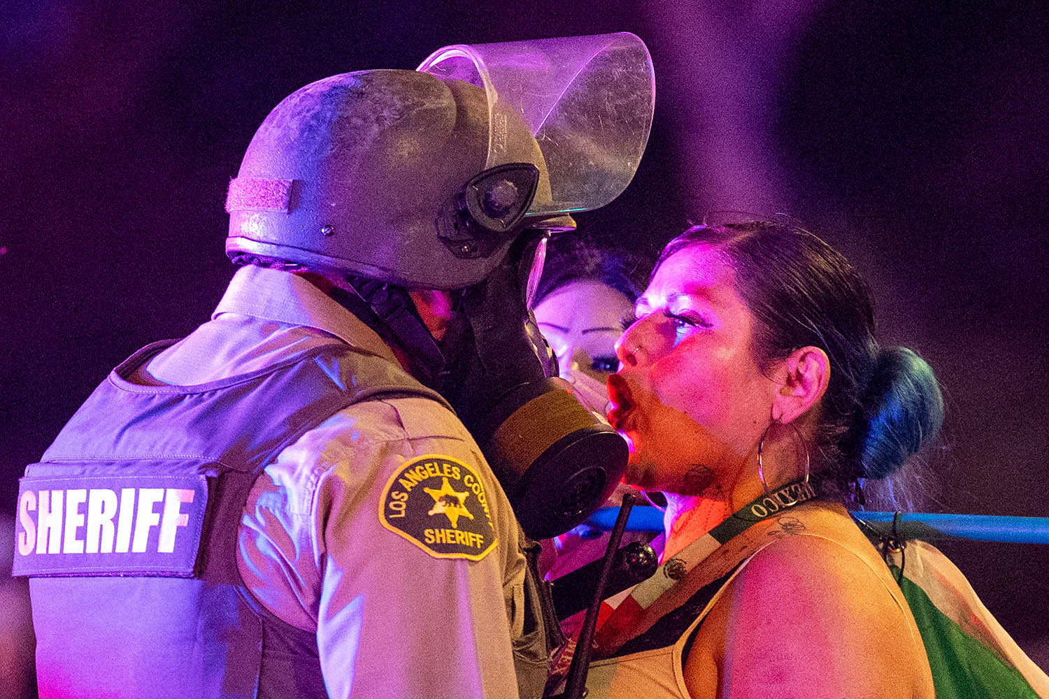 A protester faces off with a sheriff deputy last Sunday