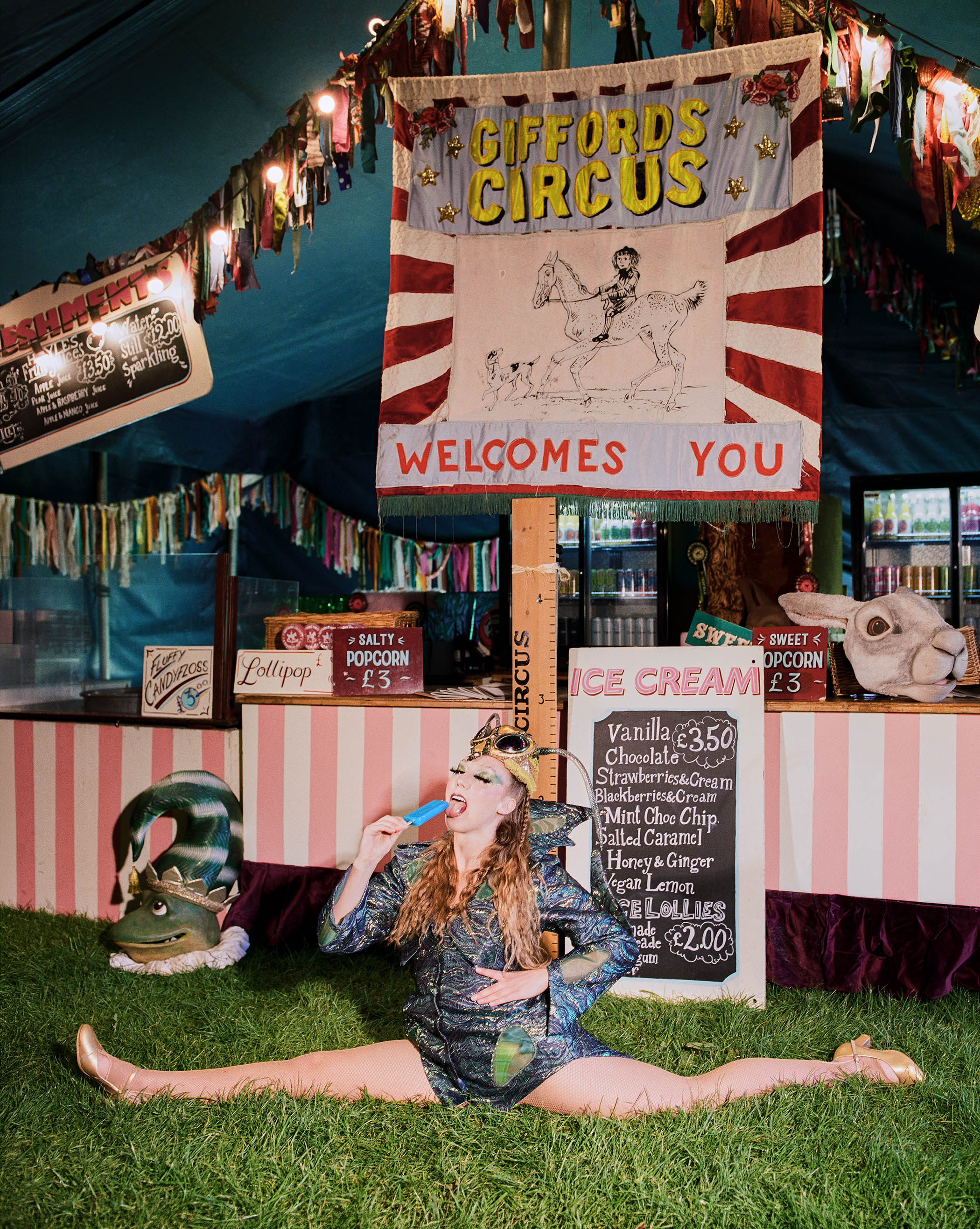 One of the Cienna sisters, dressed as a mantis, welcomes circus-goers to the big tent