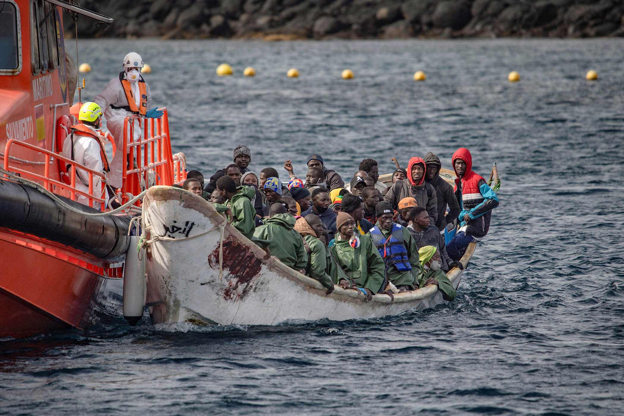 A 'cayuco' boat from Mauritania with 78 migrants onboard arrives at La Restinga port on the Canary island of El Hierro after being rescued at sea by the Spanish Salvamento Maritimo
