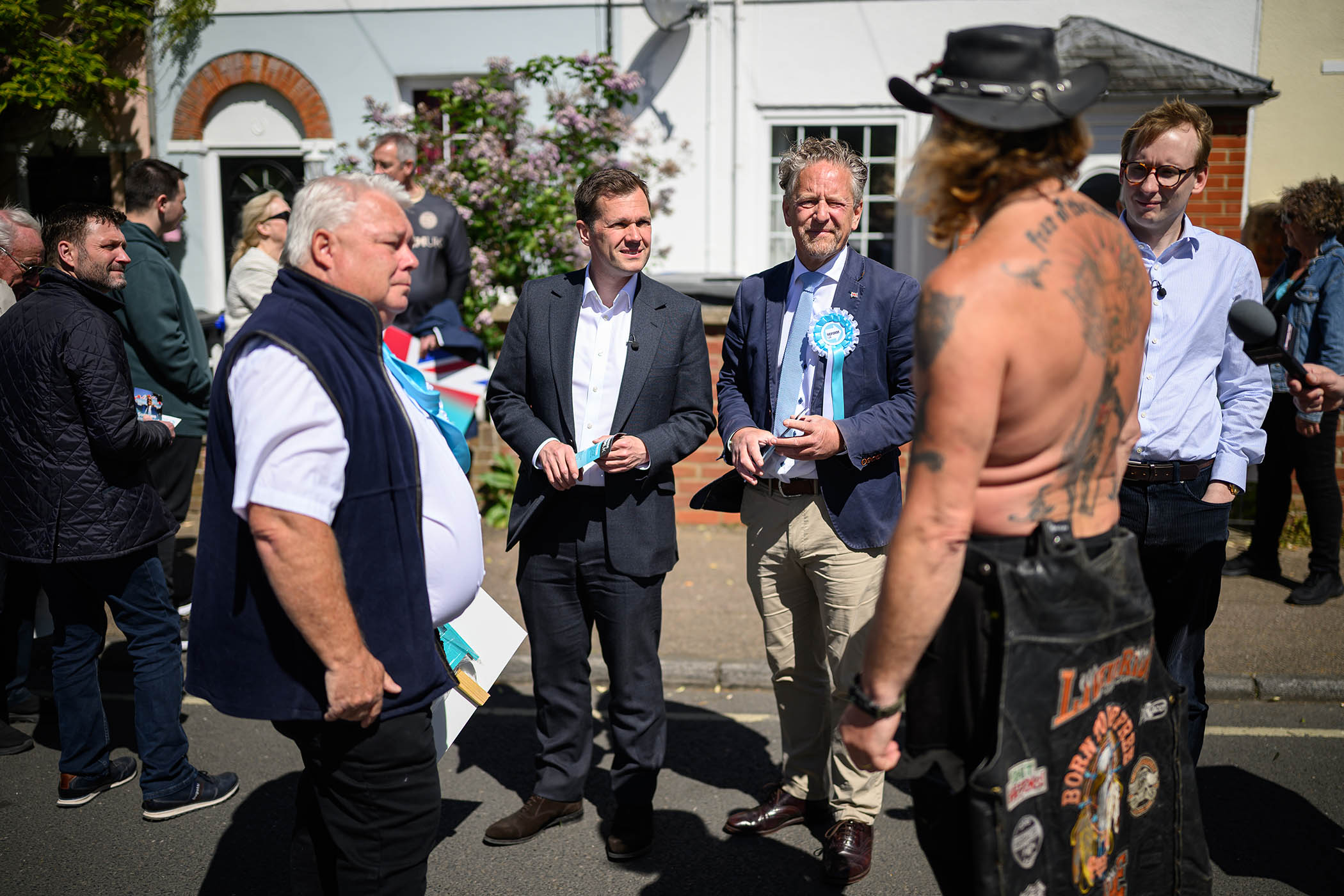Reform UK treasury spokesperson Robert Jenrick, centre, campaigning in Norfolk