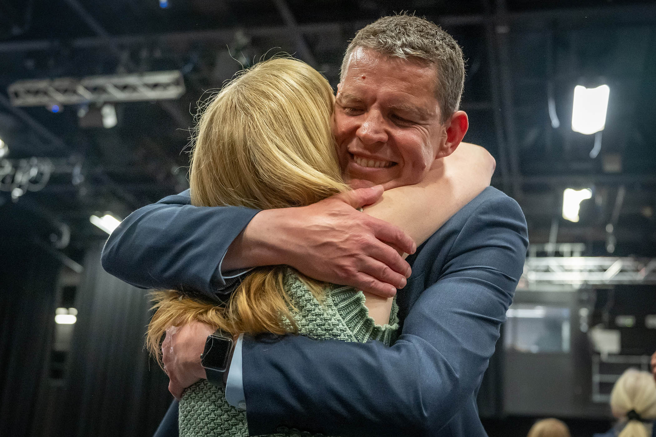 Leader of Plaid Cymru, Rhun ap Iorwerth hugs his wife Llinos in Llandudno