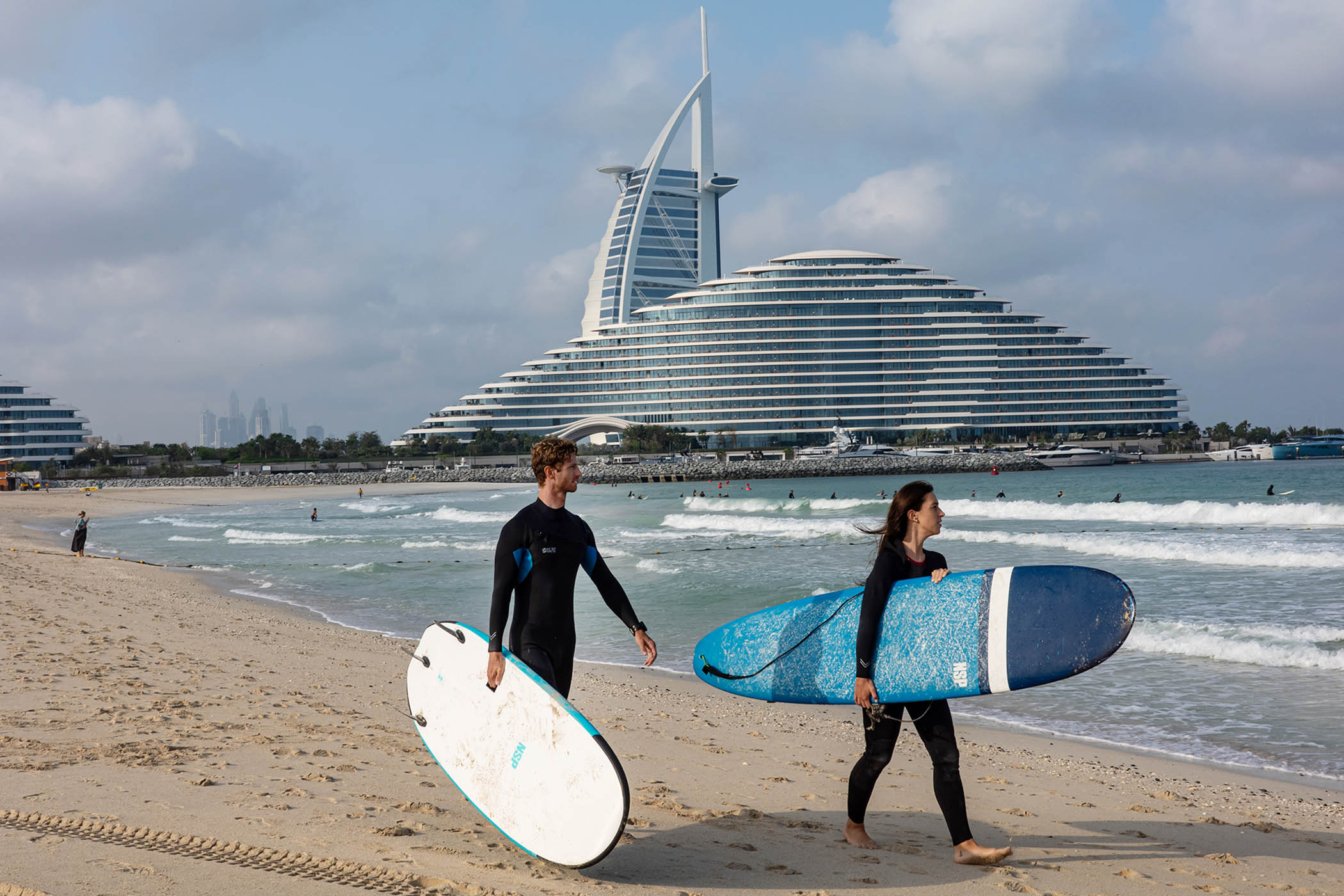 Surfers on Dubai's Jumeirah Beach
