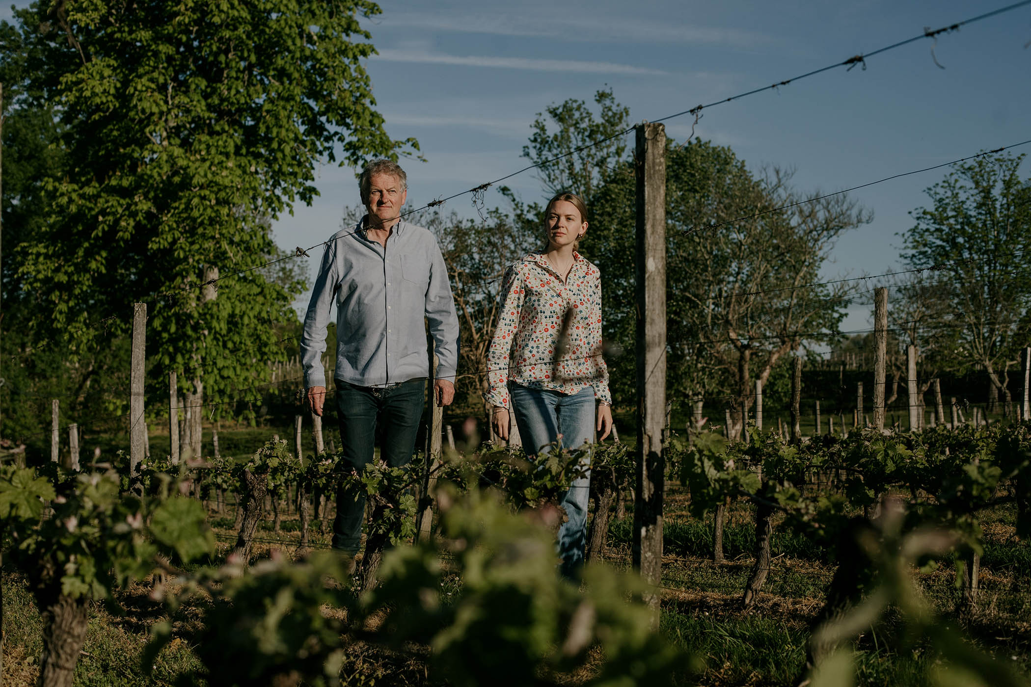Gavin Quinney, owner of Château Bauduc and his daughter Georgie in their wineyard. in Créon, Gironde, France