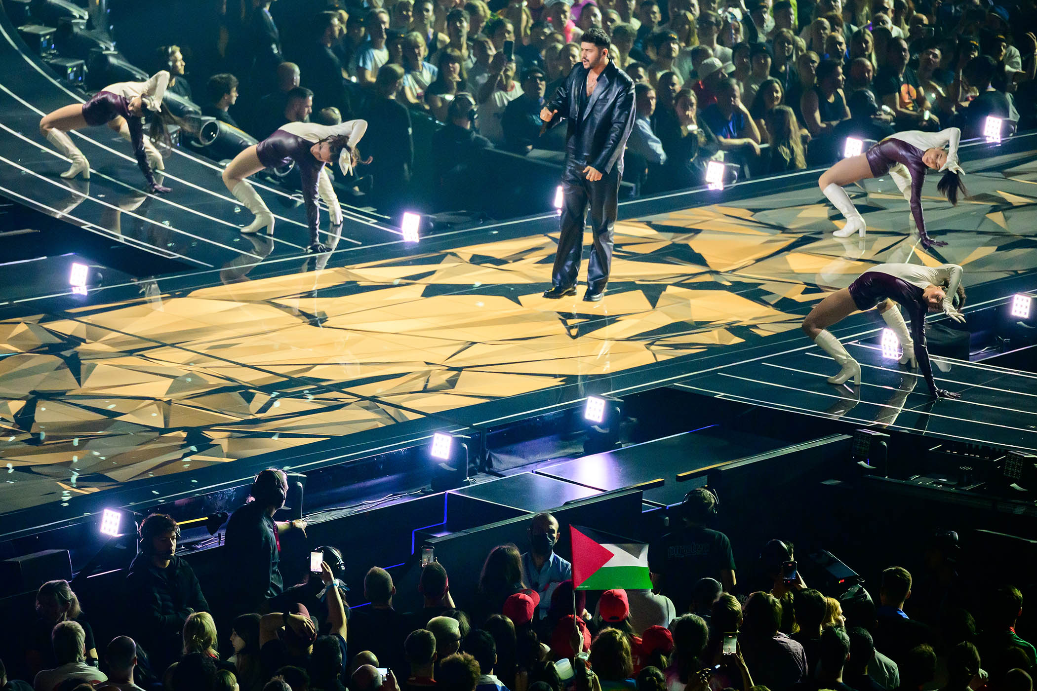 Spectators display a Palestine flag during the performance of Noam Bettan representing Israel