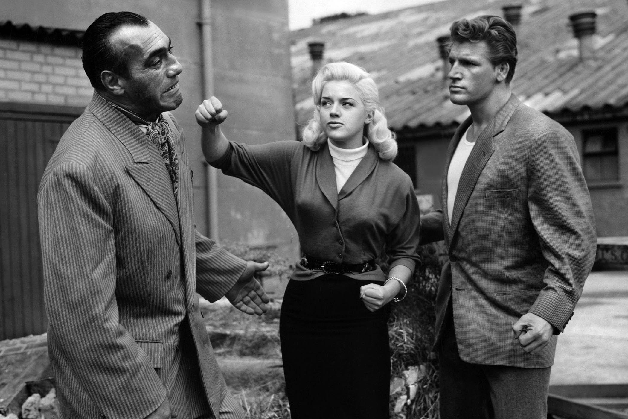 Diana Dors with Primo Carnera (left) and Joe Robinson on the set of A Kid for Two Farthings (1952). Main picture: Pauline Boty.