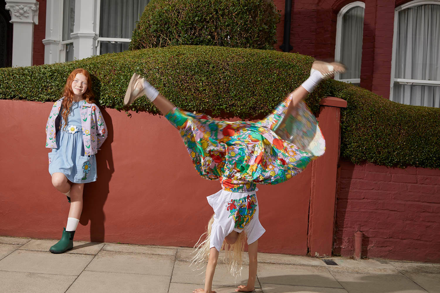 Gwen (left) Jacket and dress, both Stella McCartney. Socks, M&amp;S. Green boots, Merry People. Marlowe (right) T-shirt and skirt, both Stella McCartney. Socks, M&amp;S. Pre-loved trainers, thelittleloop