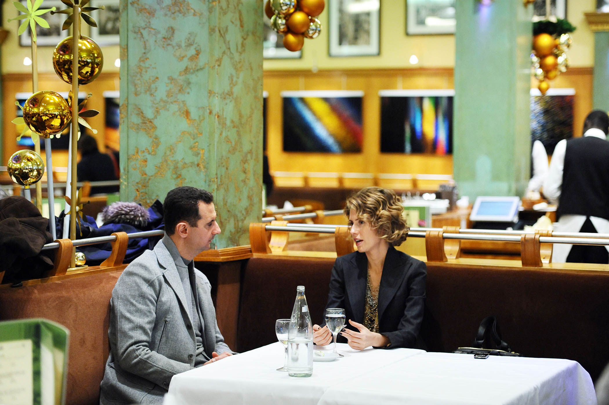 Assad and Asma in a Paris restaurant in December 2010.