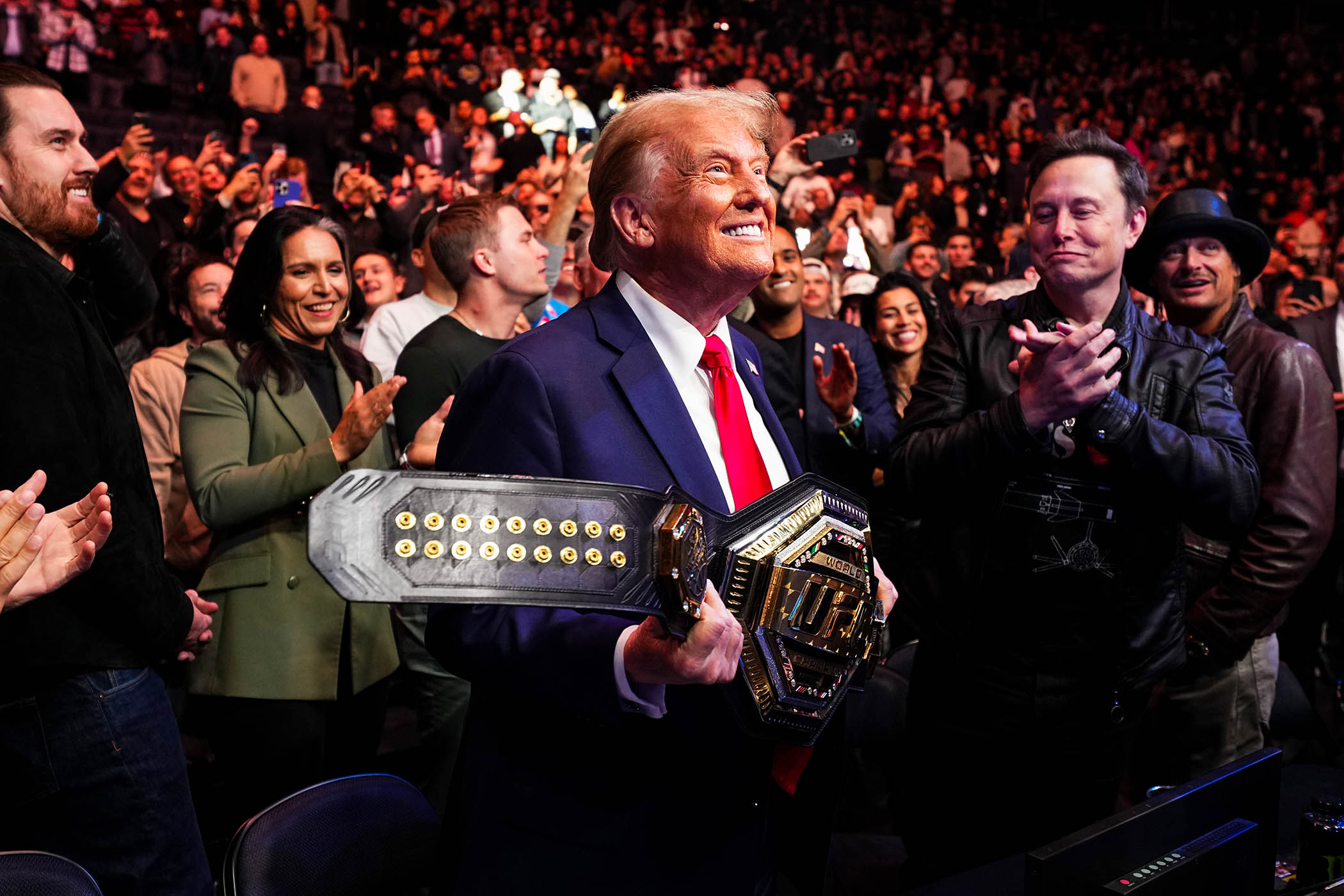 Donald Trump holds the UFC heavyweight championship belt, days after being re-elected in 2024