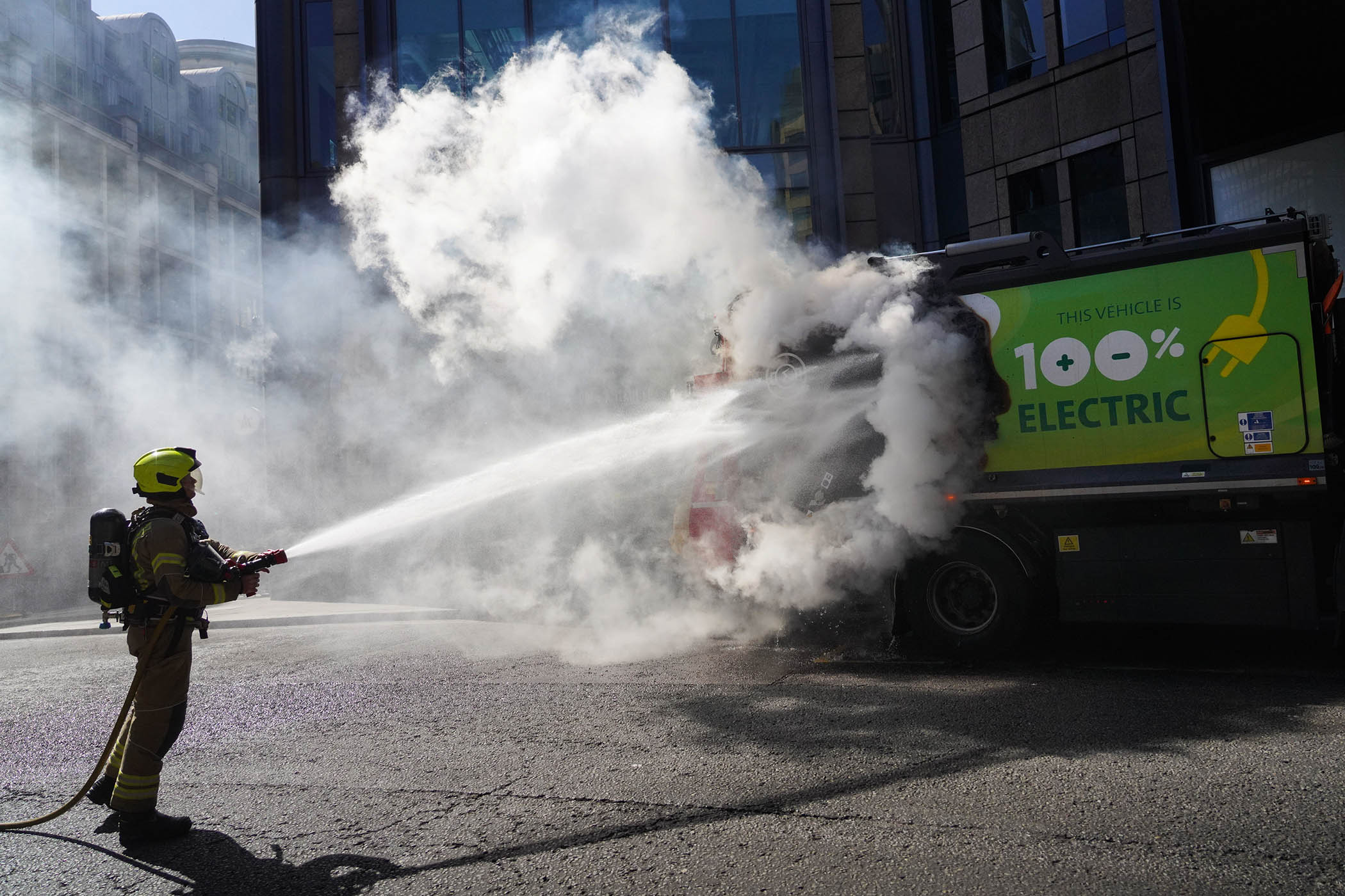 The London fire brigade tackles a fire that started in a rubbish truck