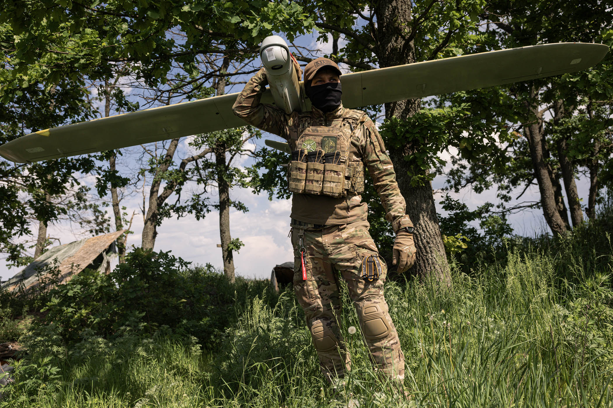 Member of the Lava Unmanned Systems Regiment, Norman, poses for a photograph with a Leleka reconnaissance UAV, capable of flying up to 120 kilometres and returning to base