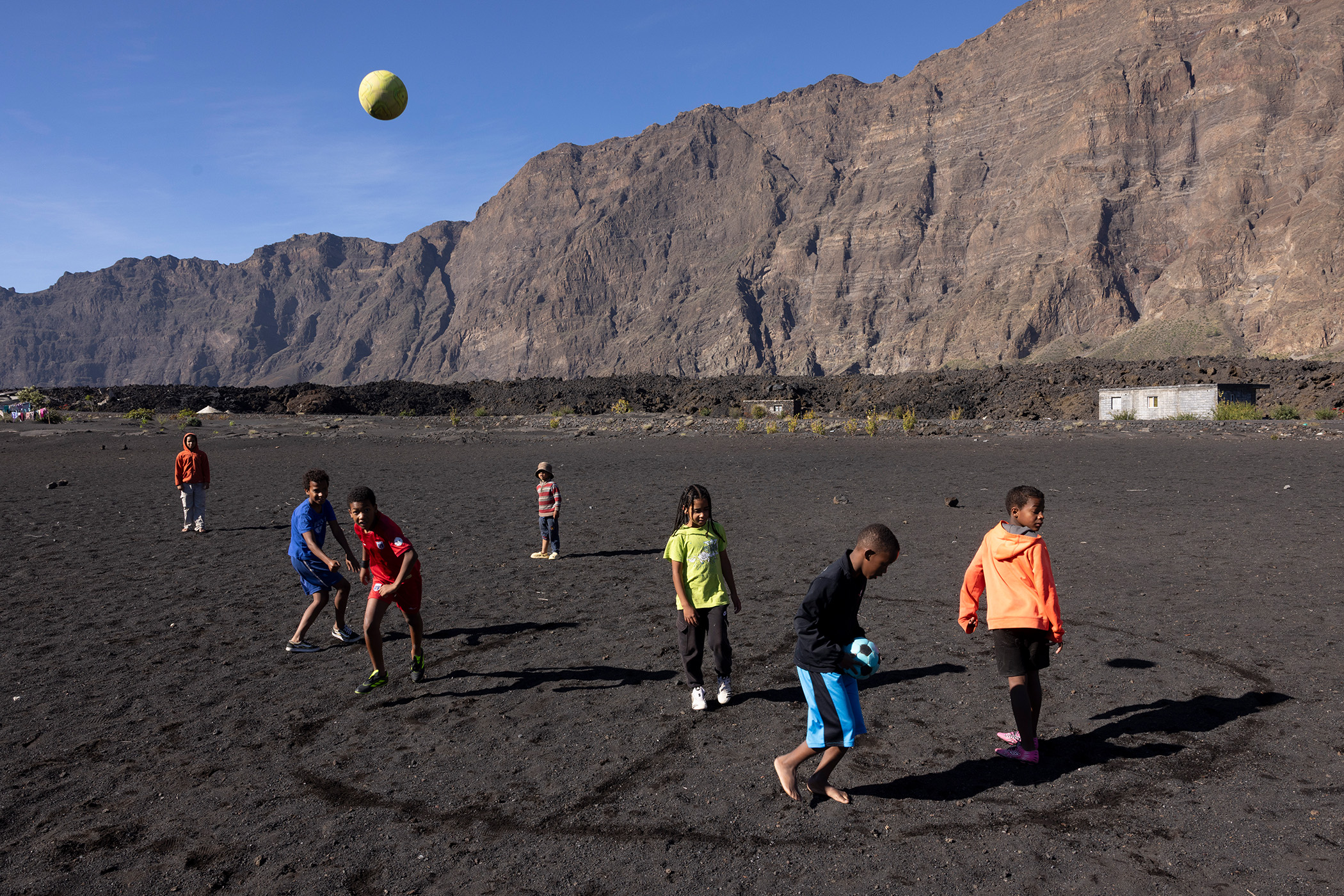 High hopes: children enjoy themselves on a pitch made from volcanic stone.