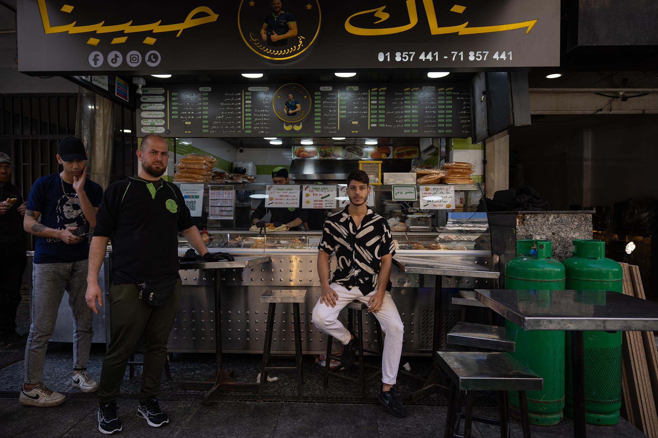 Suheil Hamad, 22, sits outside one of the branches of his family’s Snack Habibouna restaurants in central Beirut.