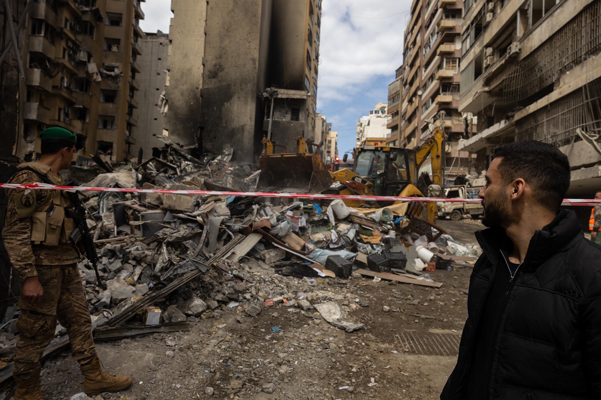 Emergency workers and Lebanese soldiers secure the site and dig through the rubble of a warehouse destroyed by an Israeli airstrike in the Barbour neighborhood in central Beirut on Wednesday.