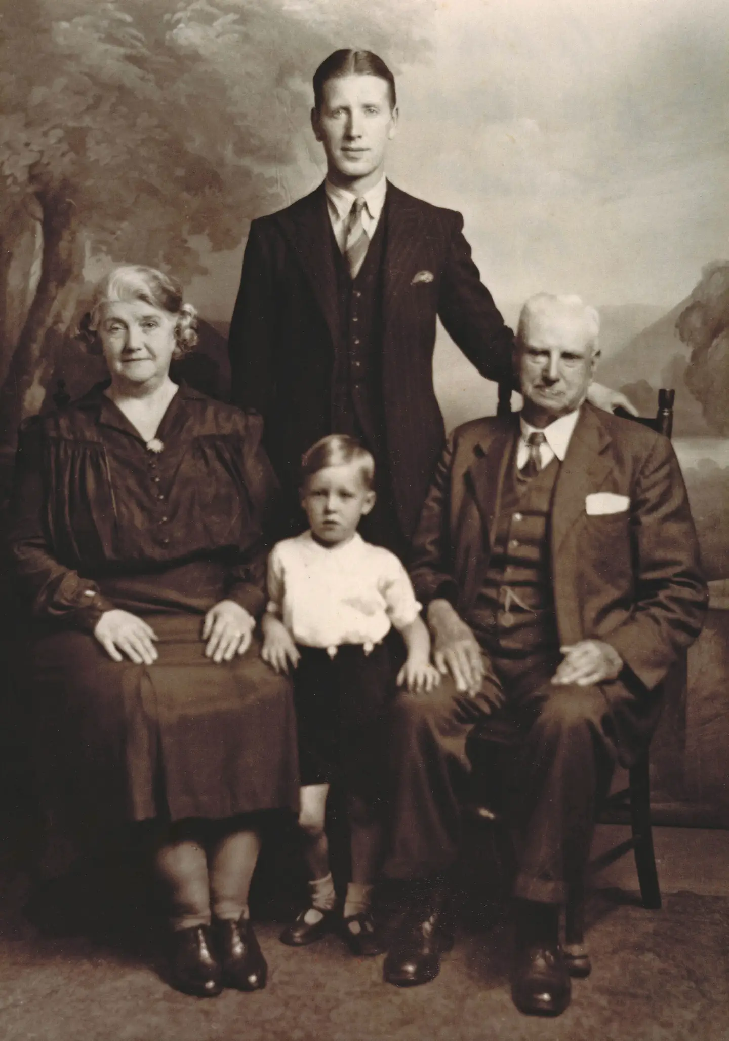A young Alex Ferguson with his father and grandparents