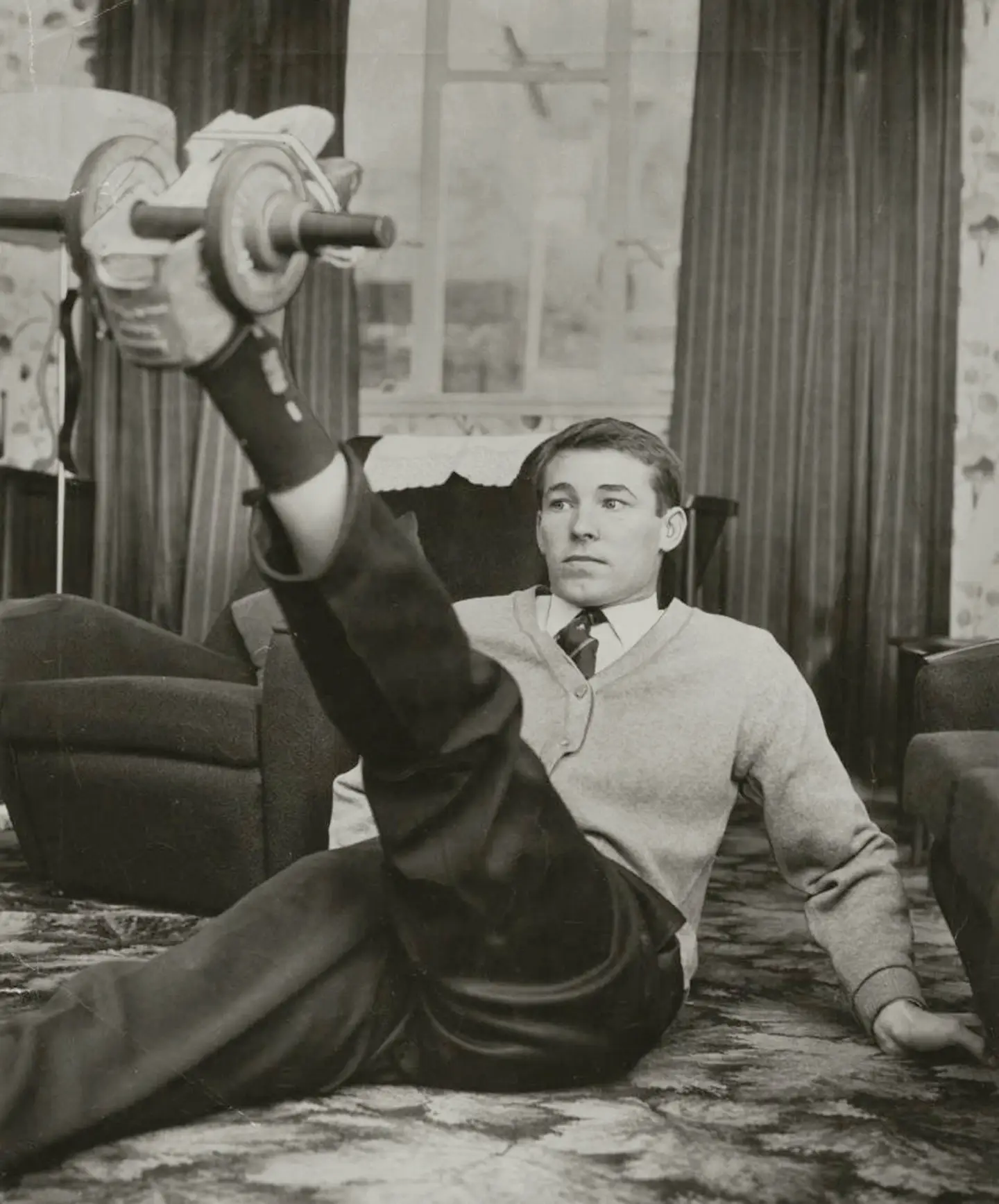 A young Alex Ferguson exercising at home
