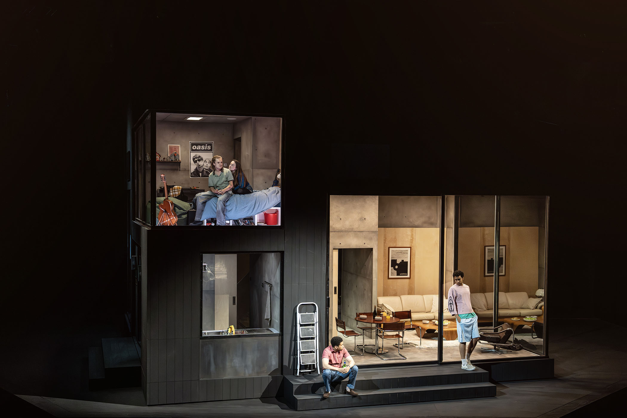 The stage revolves slowly to reveal the different parts of a 21st-century house
