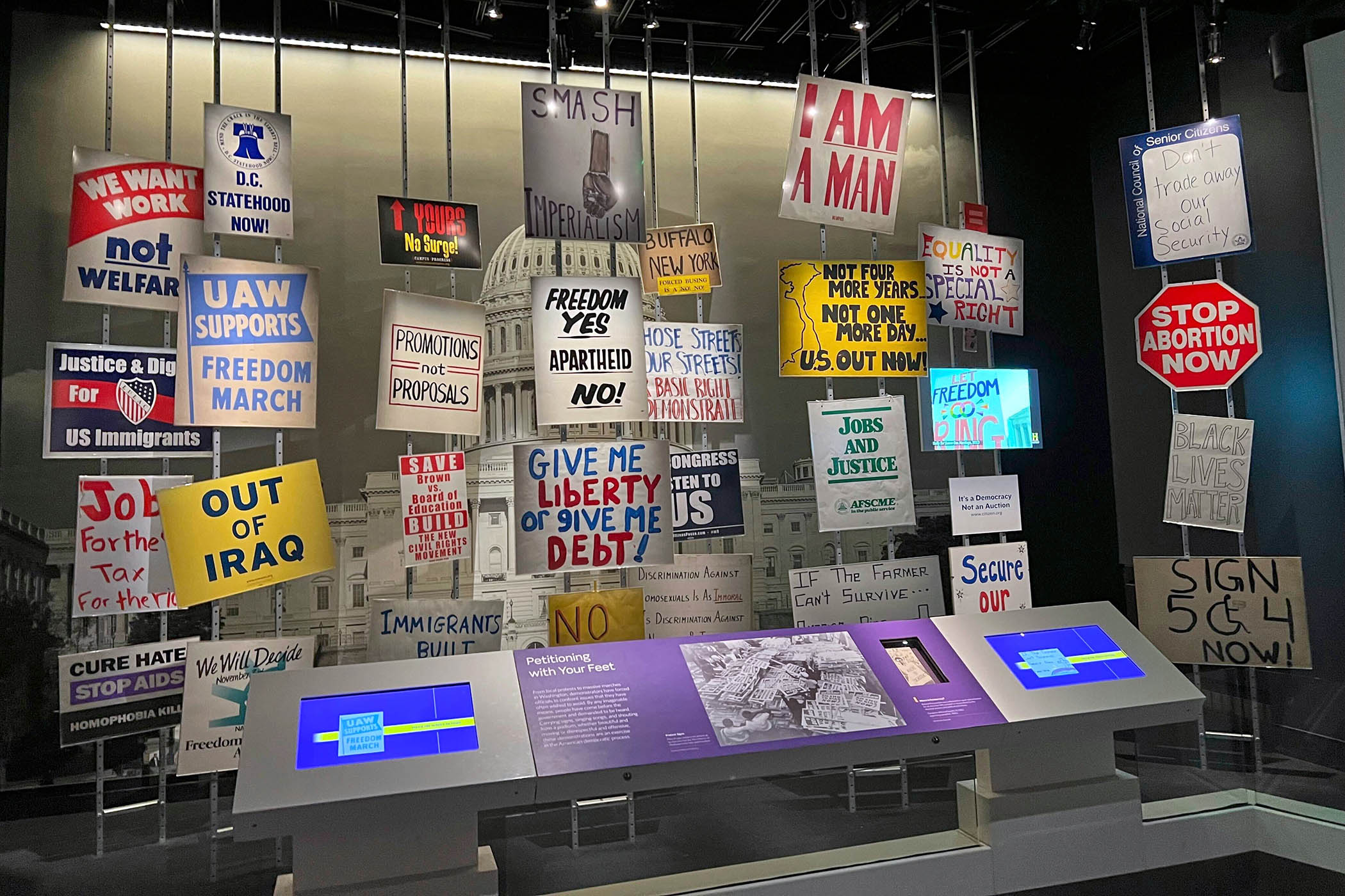 Protest signs from a selection of historic demonstrations on display at the Smithsonian’s National Museum of American History
