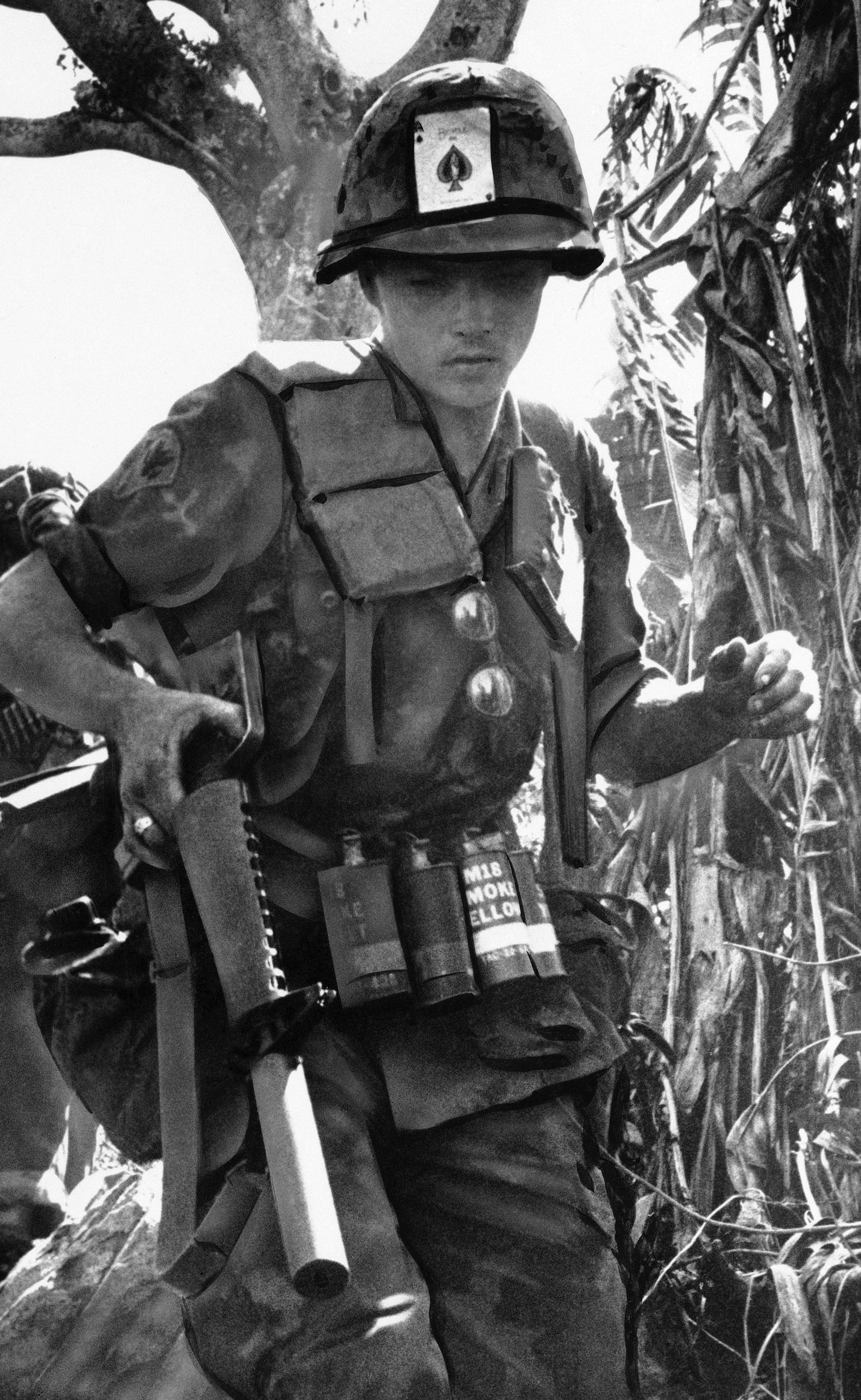 A US soldier with the ace of spades stuck in his helmet, north-west of Saigon, 1970