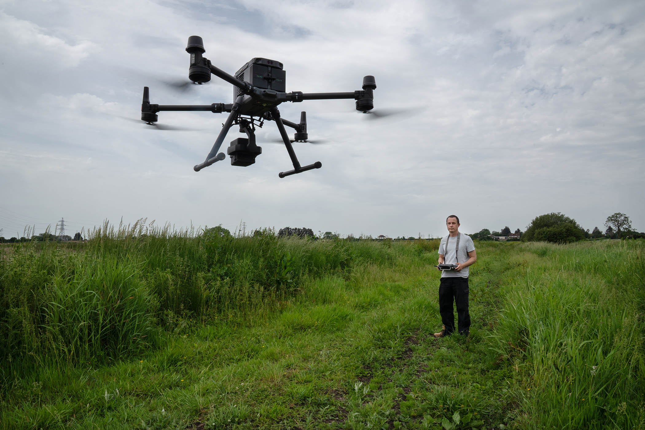 Will Barnard flies one of the drones used to seed the marshland.