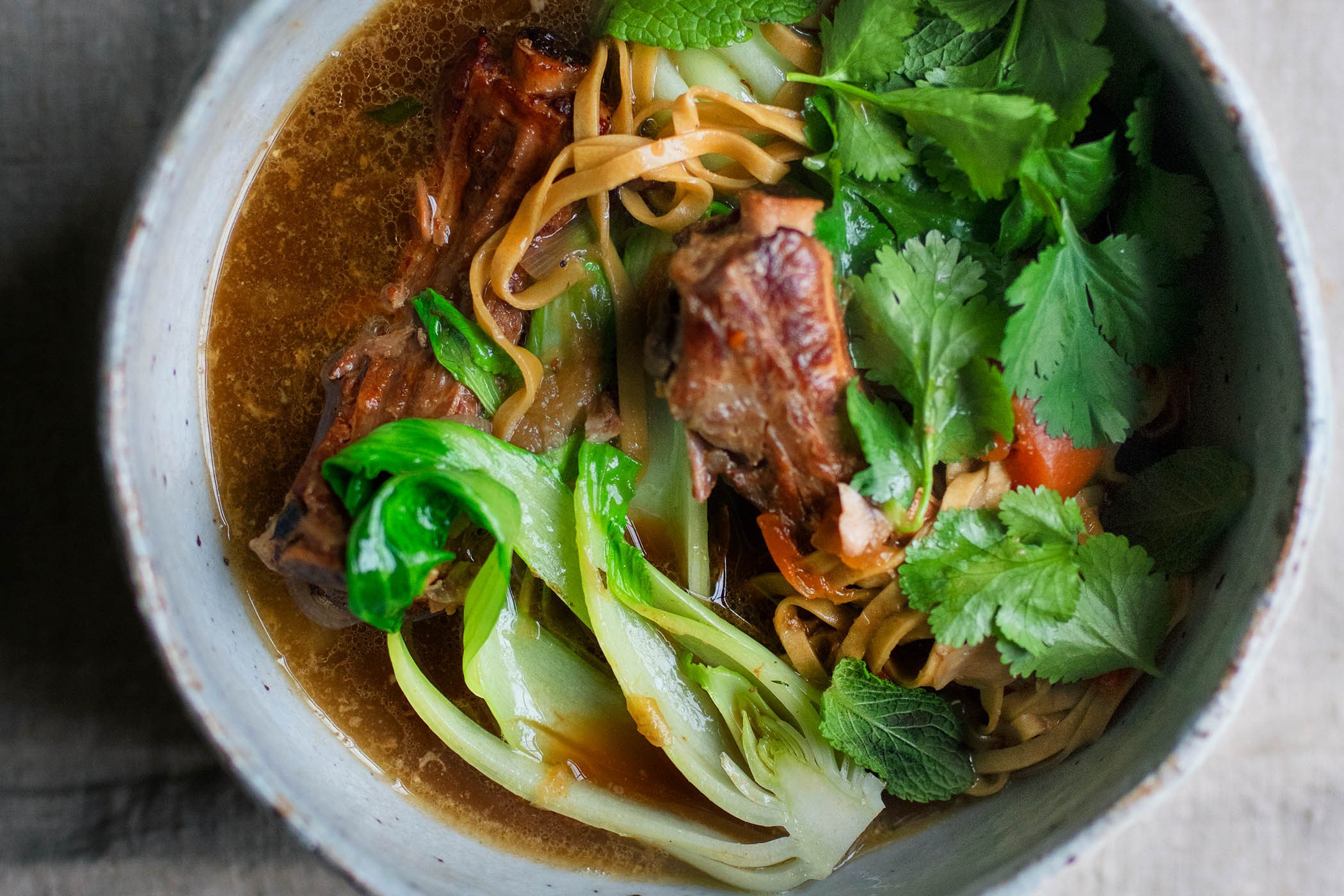 Nigel Slater’s pork broth with noodles and greens