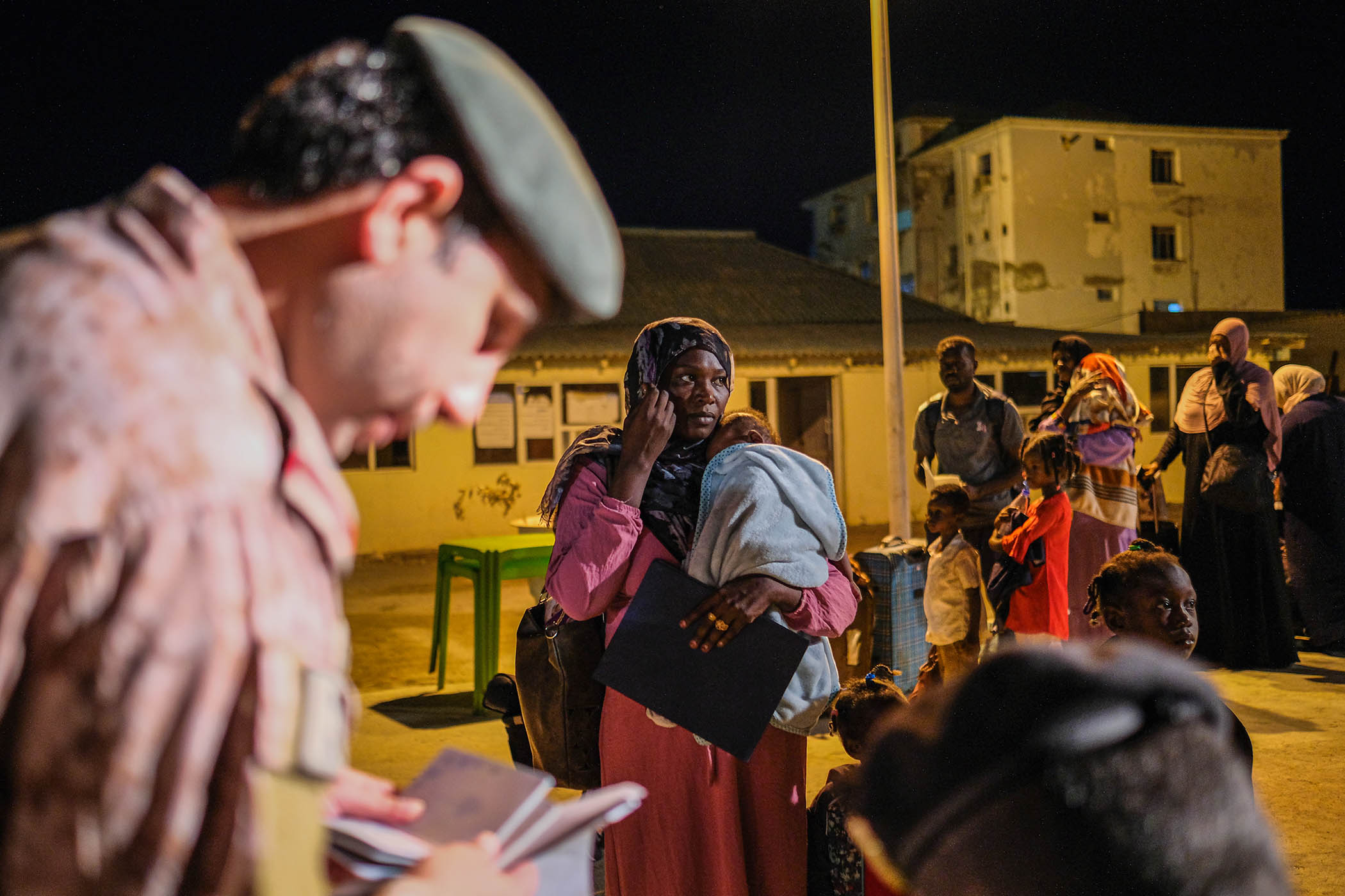Evacuees at Port Sudan fleeing to neighbouring countries.