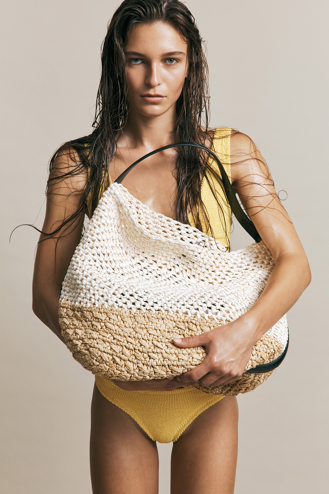 Oversized toteYellow bikini, Hunza G; woven bag Toteme