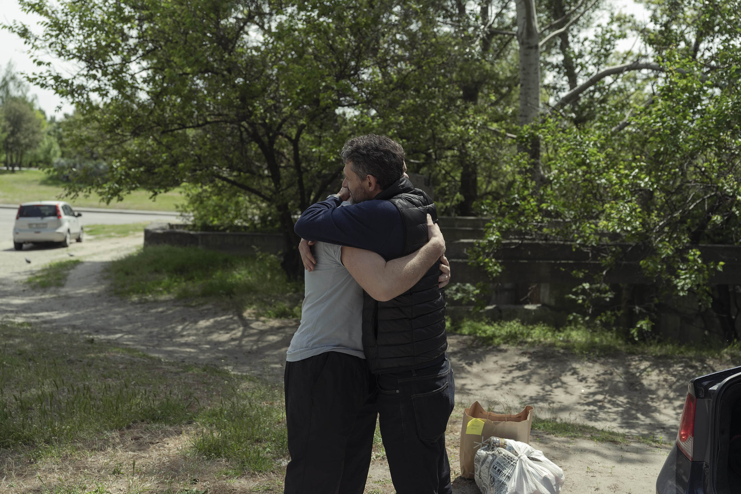 ‘Meetty is always with me in the background, even when I’m elsewhere’: Oleksiy hugs his brother as he prepares to join his unit